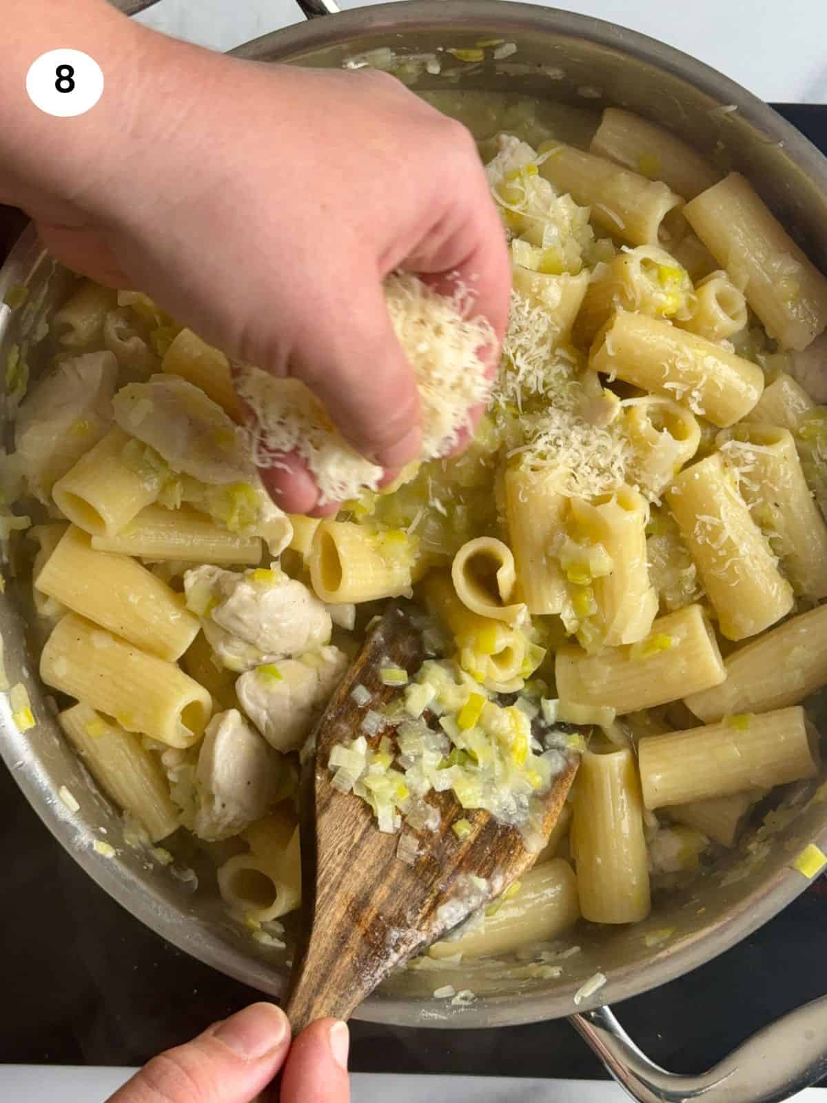 Adding the grated parmesan cheese.