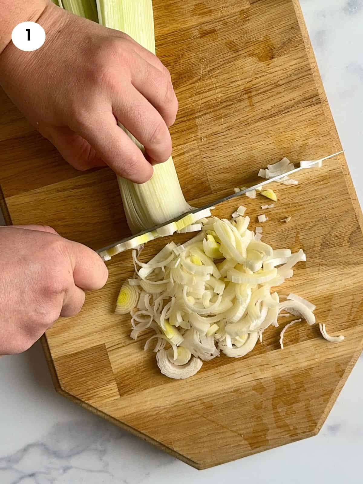 Cutting the leeks into slices.