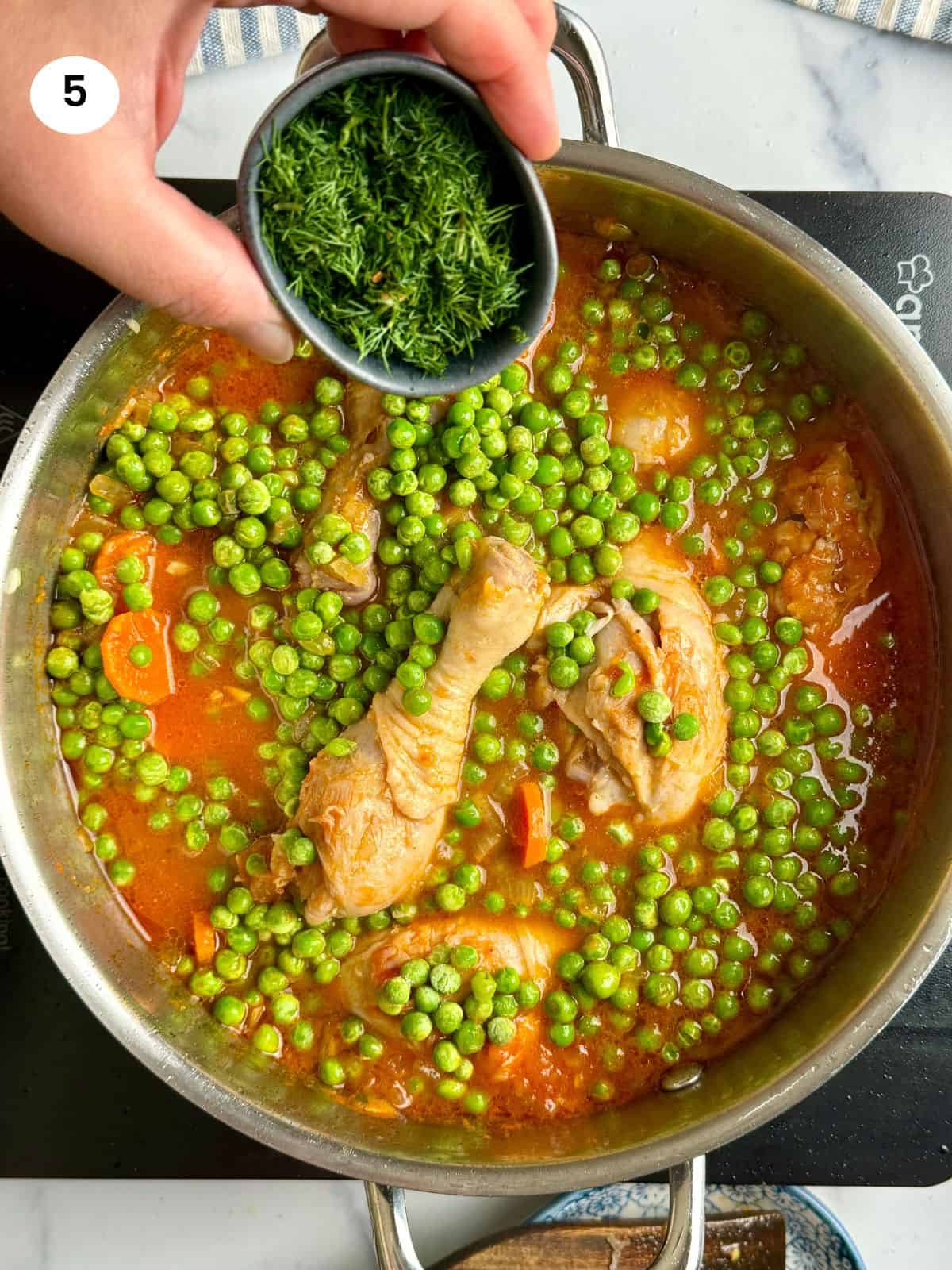 Adding the peas and fresh dill to the pot.