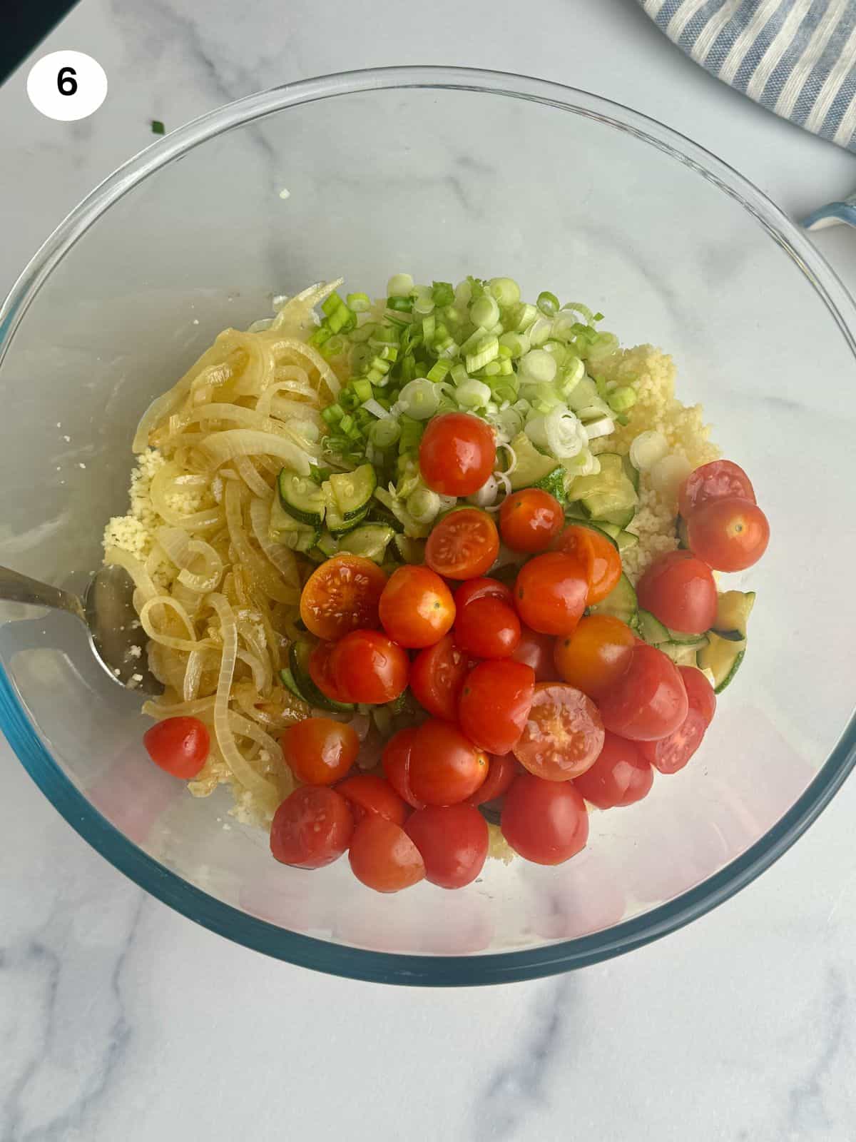 Adding the ingredients to a salad bowl.