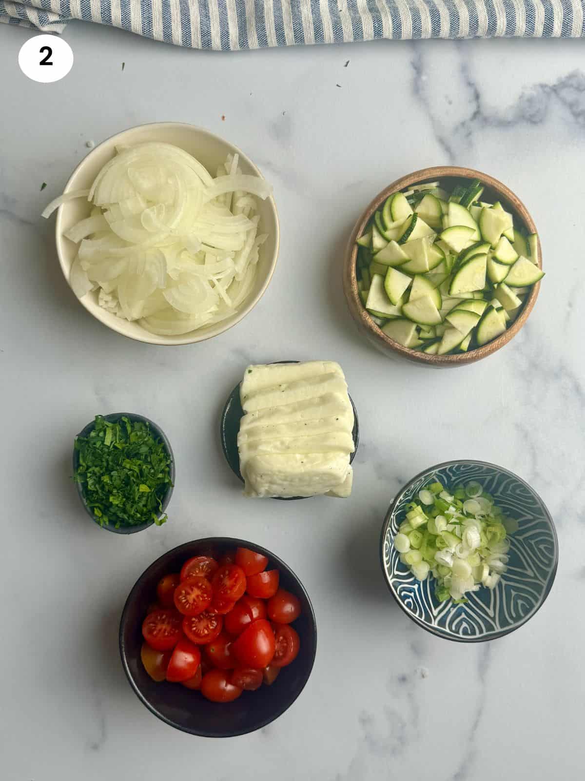 Chopped veggies in bowls for the couscous salad.