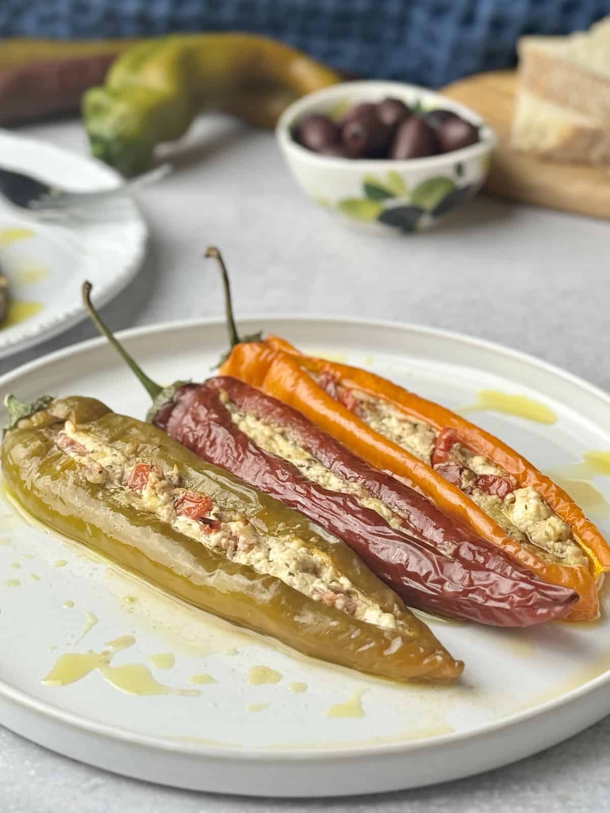 Stuffed peppers served on white plate.