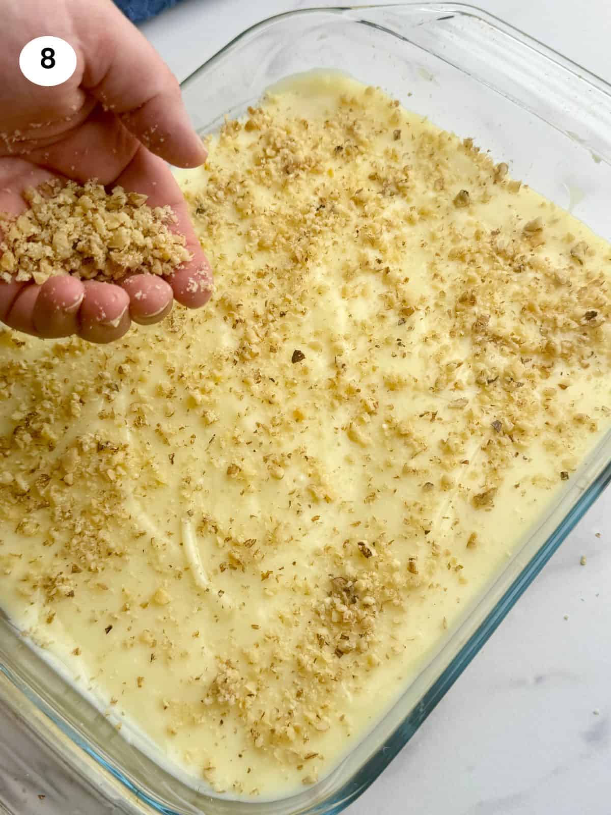 Putting rice pudding to individual bowls.