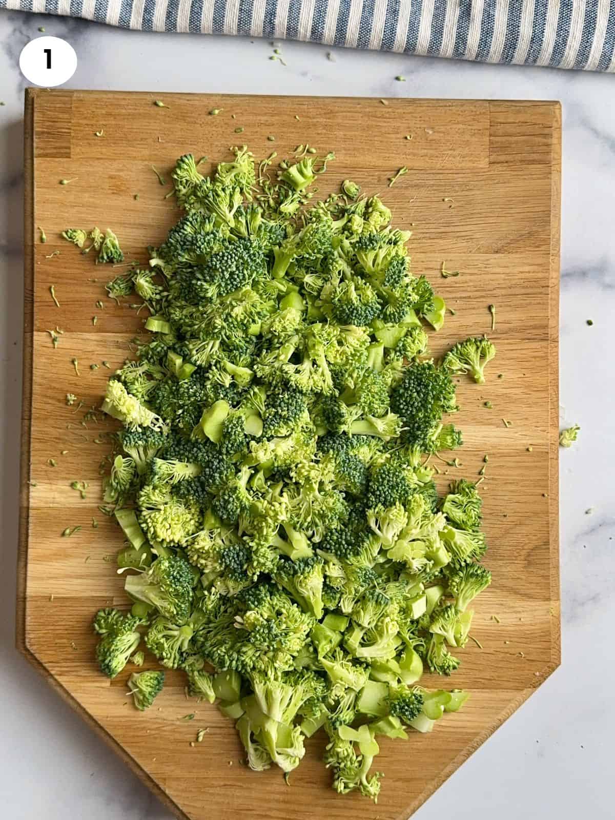 Cutting the broccoli into smaller bits.