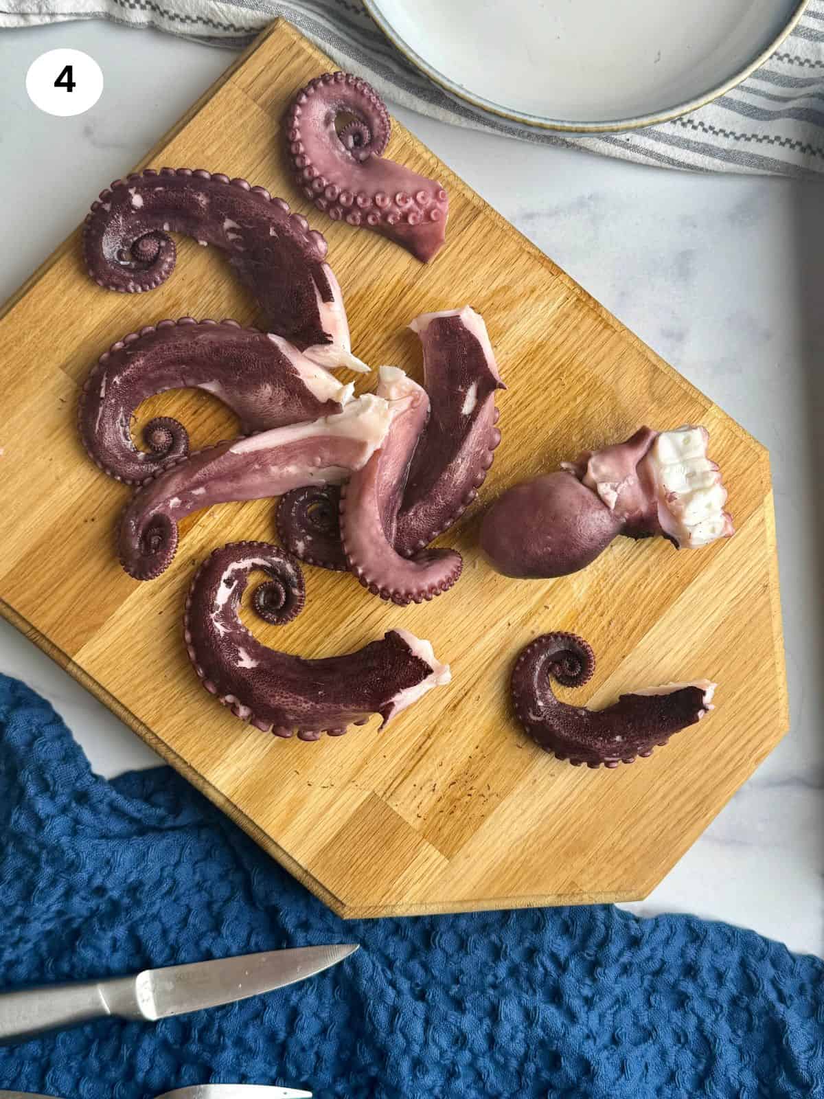 Chopping the tentacles of the head of the octopus.