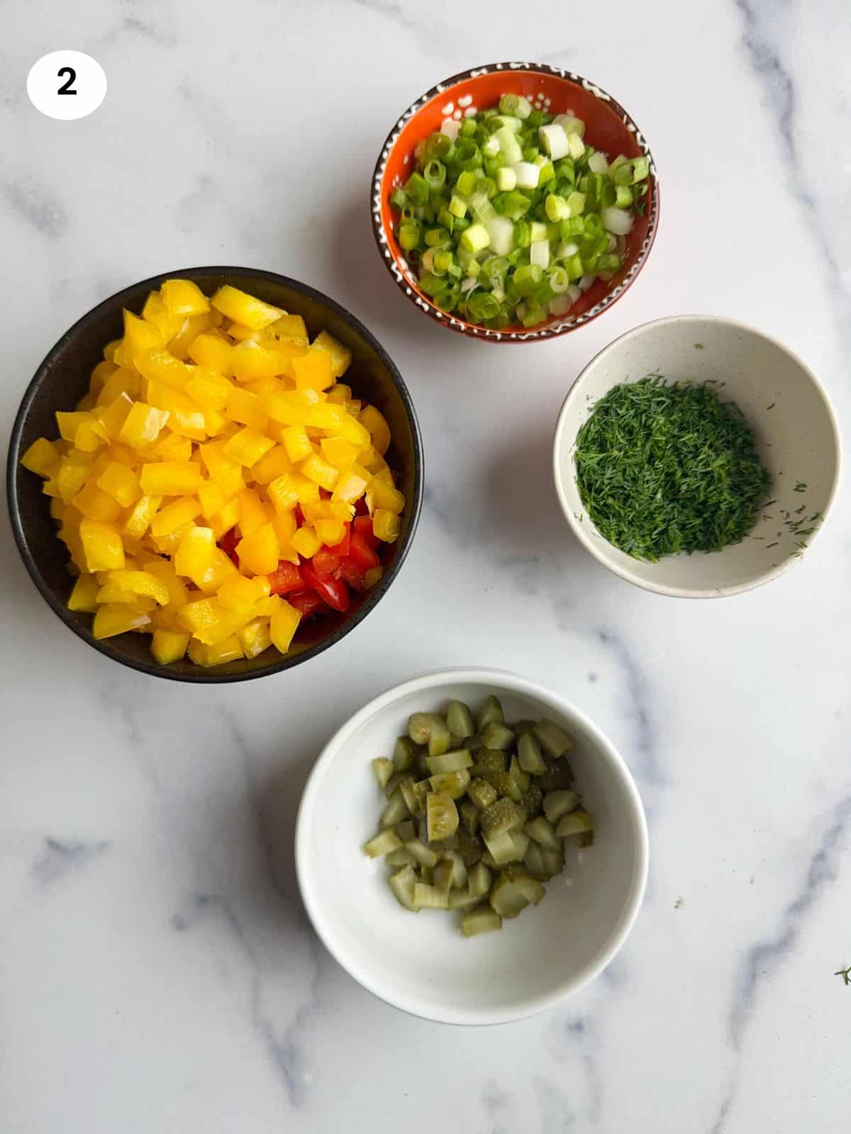 Vegetables cut in small bowls.