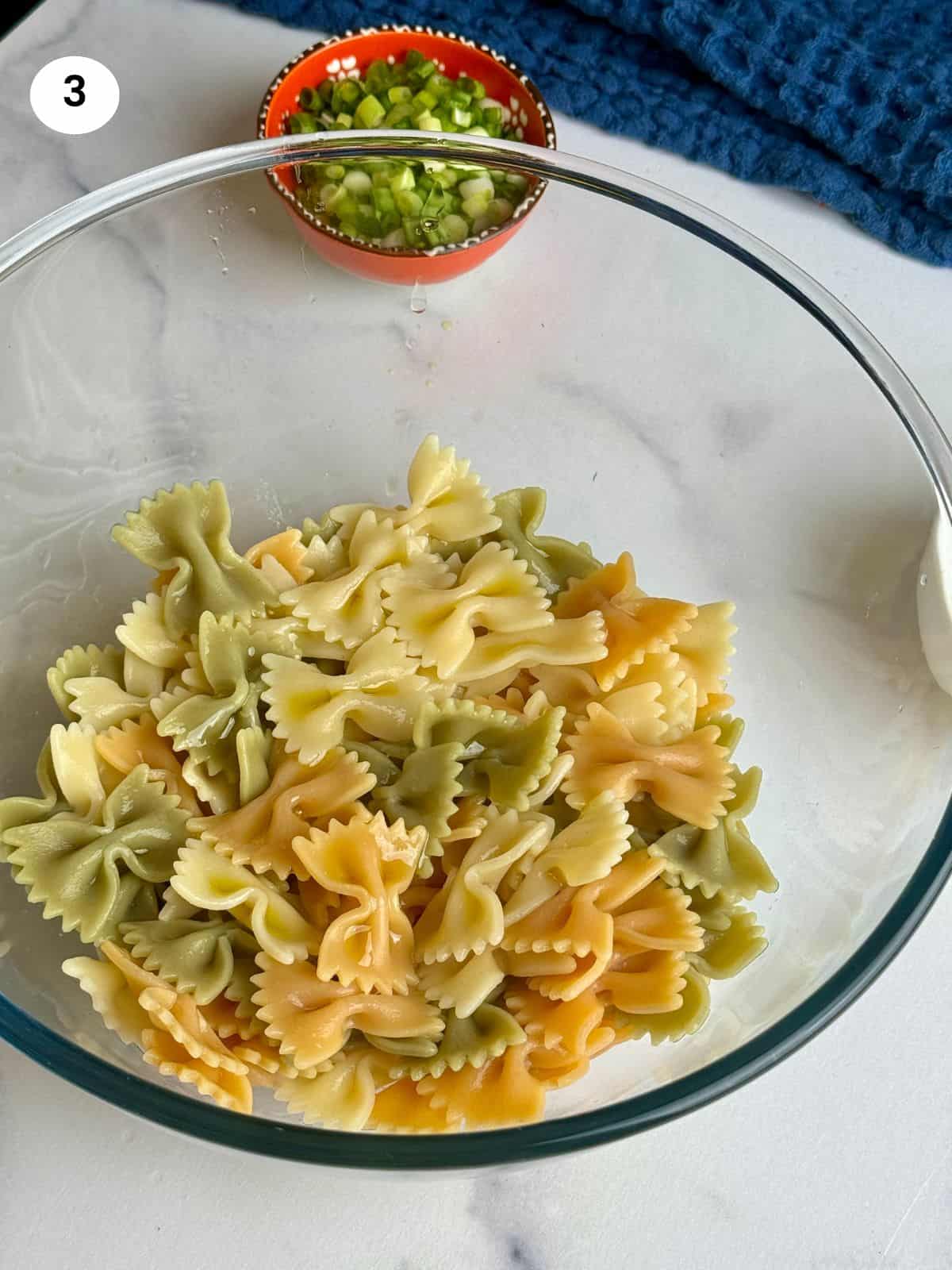 Pasta in a glass bowl before adding the rest of the ingredients.