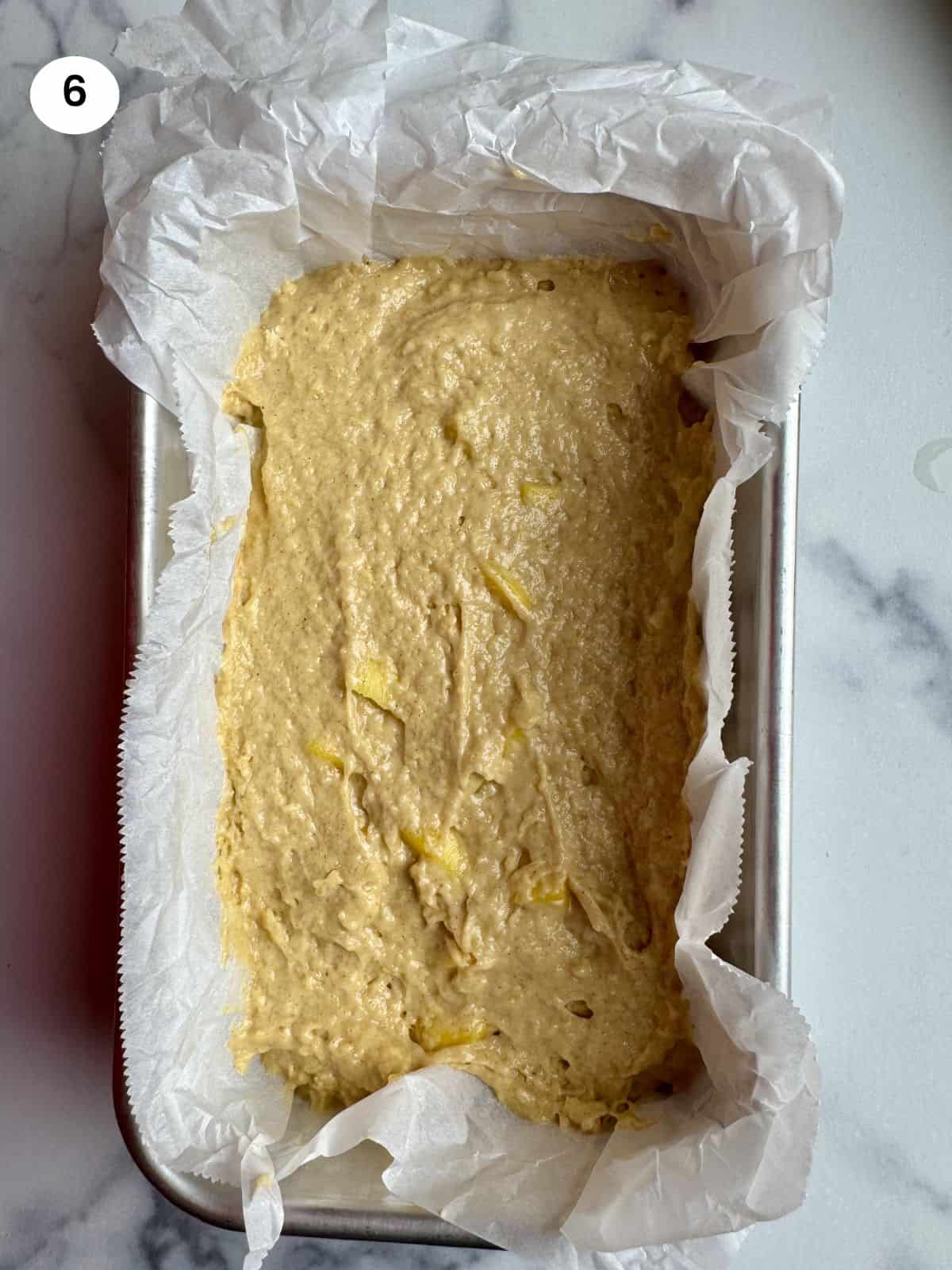 Mango cake batter in the loaf tin ready for the oven.